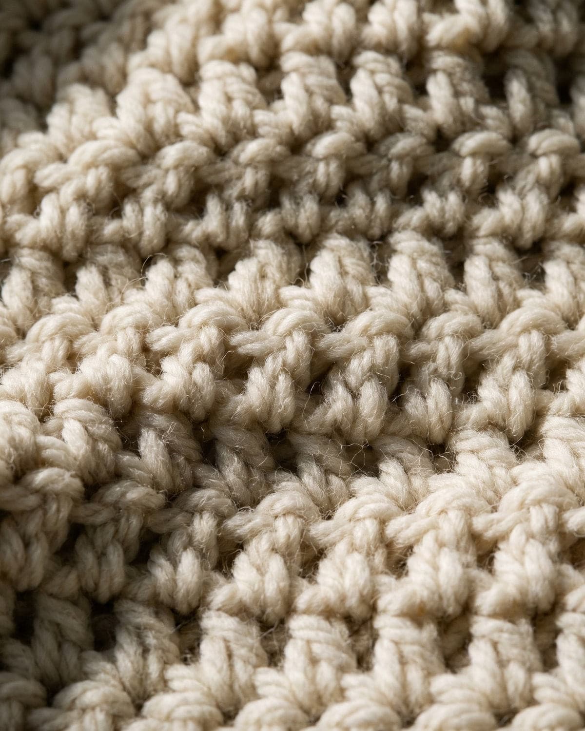 Close-up of thick cream chunky crochet stitches